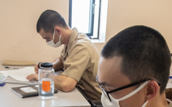 210810-N-YF306-0053 NEWPORT, R.I (Aug. 10, 2021) Officer Candidate Plot Course During Class