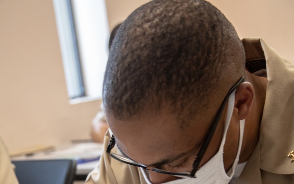 210810-N-YF306-0058 NEWPORT, R.I (Aug. 10, 2021) Officer Candidate Plots Point During Class