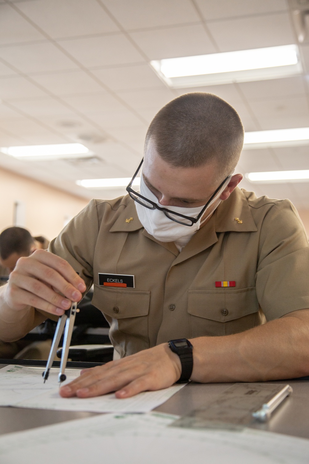 210810-N-YF306-0060 NEWPORT, R.I (Aug. 10, 2021) Office Candidate Uses Compass During Class