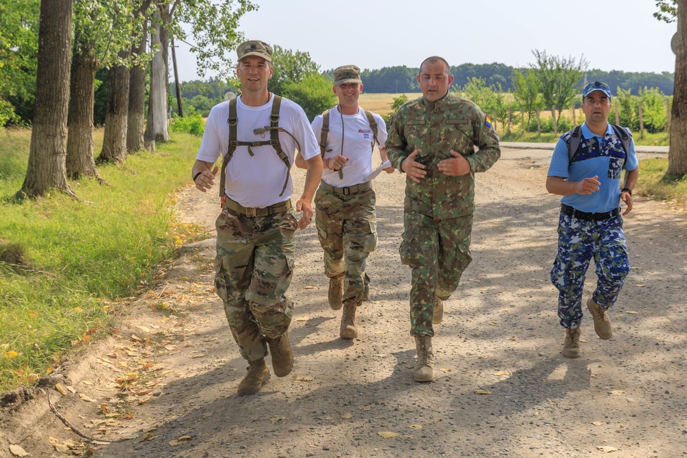 American and Romanian reserve service members participate in an orienteering training event