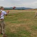 Staff Sgt. Devin Crawford catches a football from a Romanian Reserve Soldier