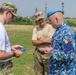 Staff Sgt. Trevor Thompson trades patches with a Romanian Air Defense Reserve Soldier