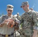 Sgt. Morgan Figgs shows a Romanian reserve Soldier orienteering techniques