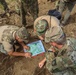 American and Romanian reserve service members practice map reading