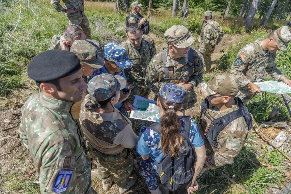 American and Romanian reserve service members practice map reading