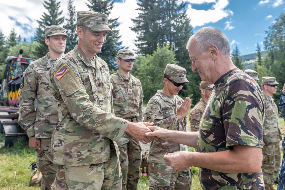 Sgt. Morgan Figgs receives a patch from Lt. Gen. (Ret.) Virgil Balaceanu