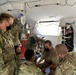 Medics work to stabilize a simulated combat casualty at Global Medic 21-02