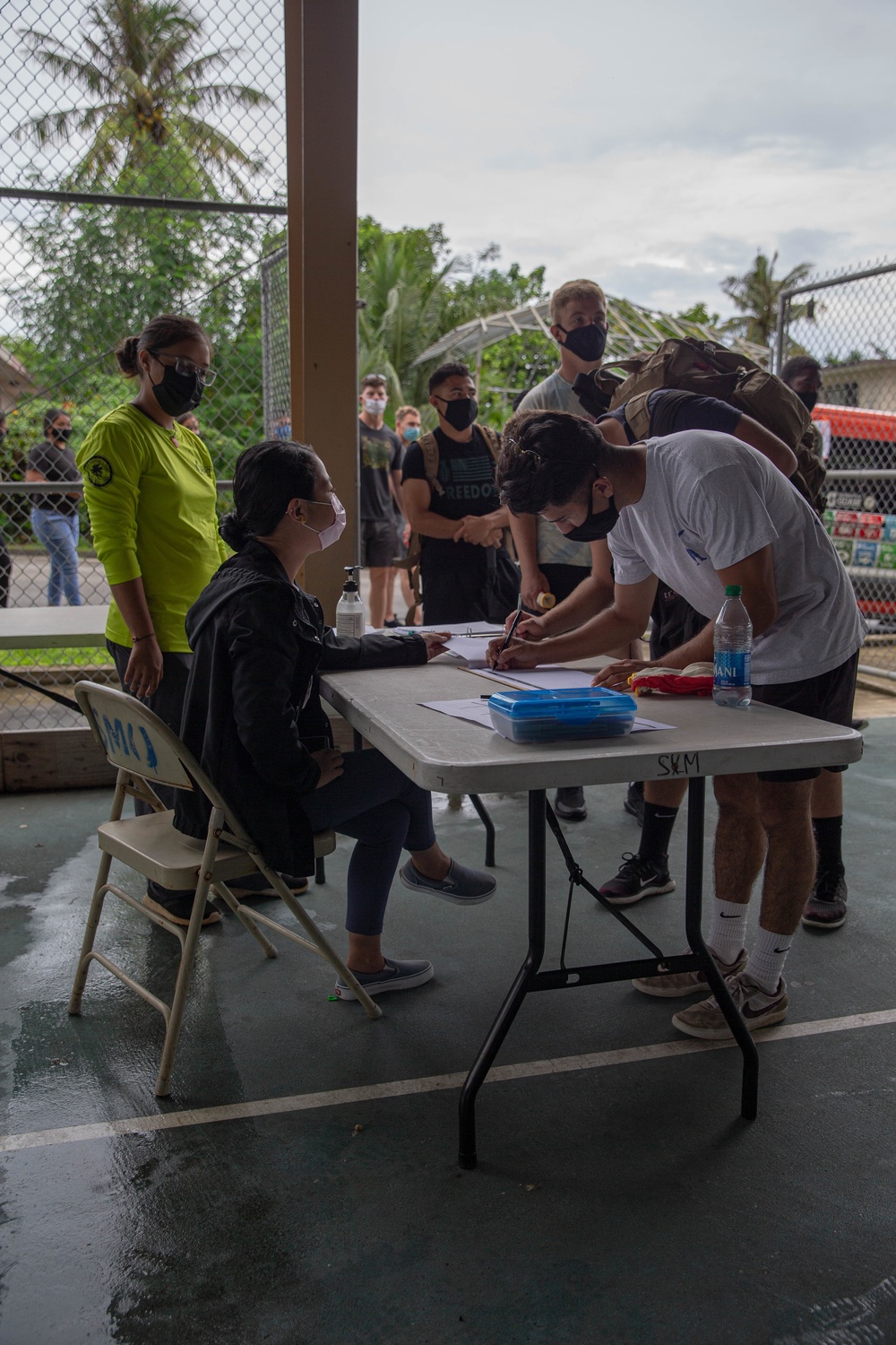 U.S. Marines volunteer within a local Guam community
