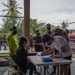 U.S. Marines volunteer within a local Guam community