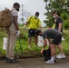 U.S. Marines volunteer within a local Guam community
