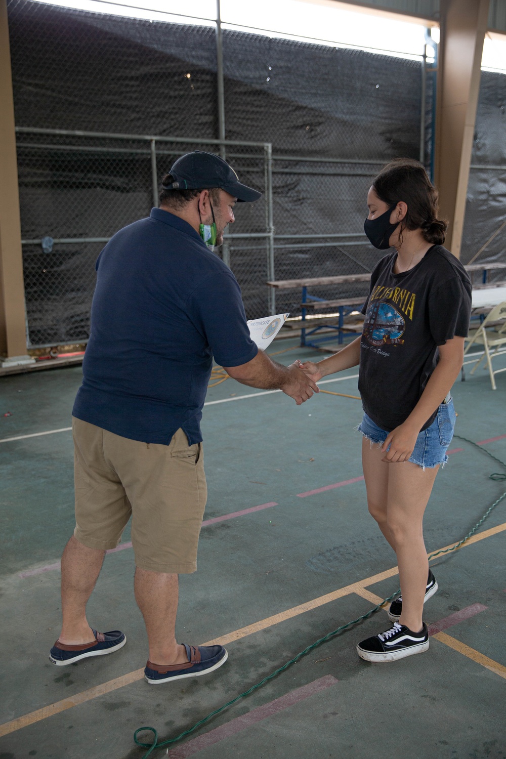 U.S. Marines volunteer within a local Guam community