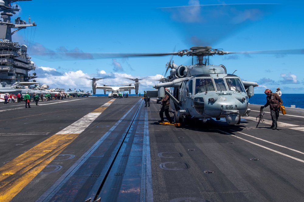 USS Carl Vinson (CVN 70) helicopter prepares to take off