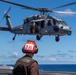 USS Carl Vinson (CVN 70) helicopter takes off flight deck