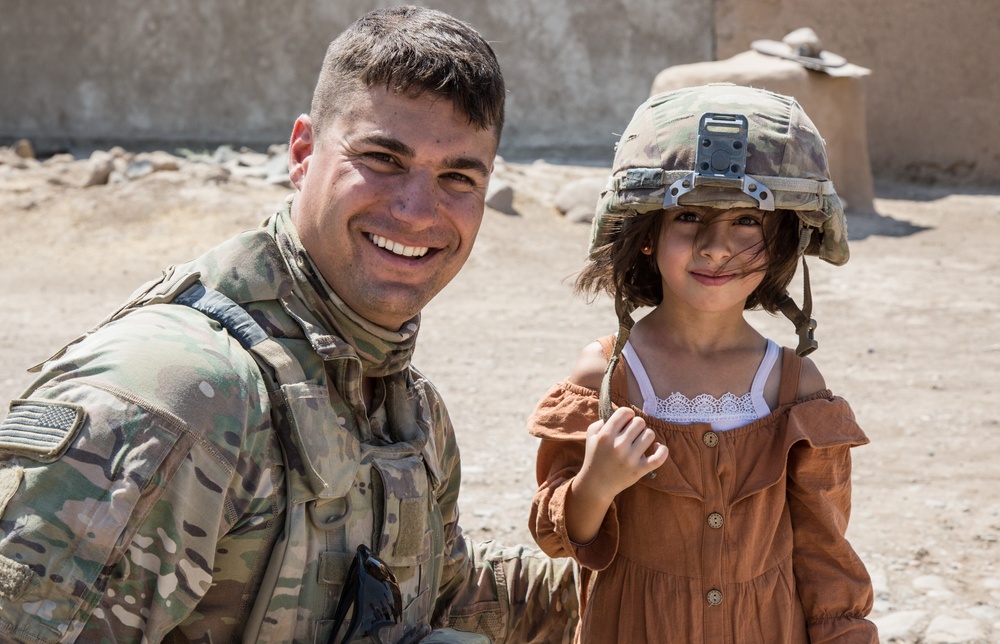 Happy child meets U.S. Troops