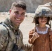 Happy child meets U.S. Troops
