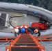 USS Miguel Keith (ESB 5) Sailors use a ladder to a RHIB