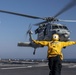 Aviation Boatswain’s Mate 3rd Class Nadezhda Zurbriggen directs an MH-60S Sea Hawk from Helicopter Sea Combat Squadron (HSC) 23 aboard expeditionary sea base USS Miguel Keith (ESB 5)