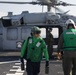 Sailors assigned to Helicopter Sea Combat Squadron (HSC) 23 offload an MH-60S Sea Hawk aboard expeditionary sea base USS Miguel Keith (ESB 5)