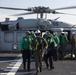 Sailors assigned to Helicopter Sea Combat Squadron (HSC) 23 offload an MH-60S Sea Hawk aboard expeditionary sea base USS Miguel Keith (ESB 5)