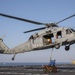 Aviation Boatswain’s Mate Airman Jacobi Easterling, left, and Airman Salva Kritzer attach cargo to an MH-60S Sea Hawk from Helicopter Sea Combat Squadron (HSC) 23 aboard expeditionary sea base USS Miguel Keith (ESB 5)