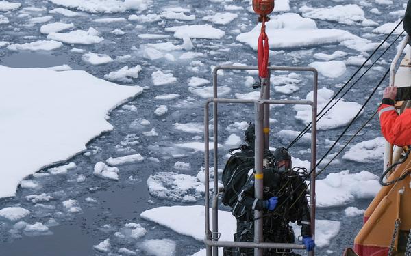 Coast Guard Cutter Healy’s temporary regional dive locker team assist with arctic operations