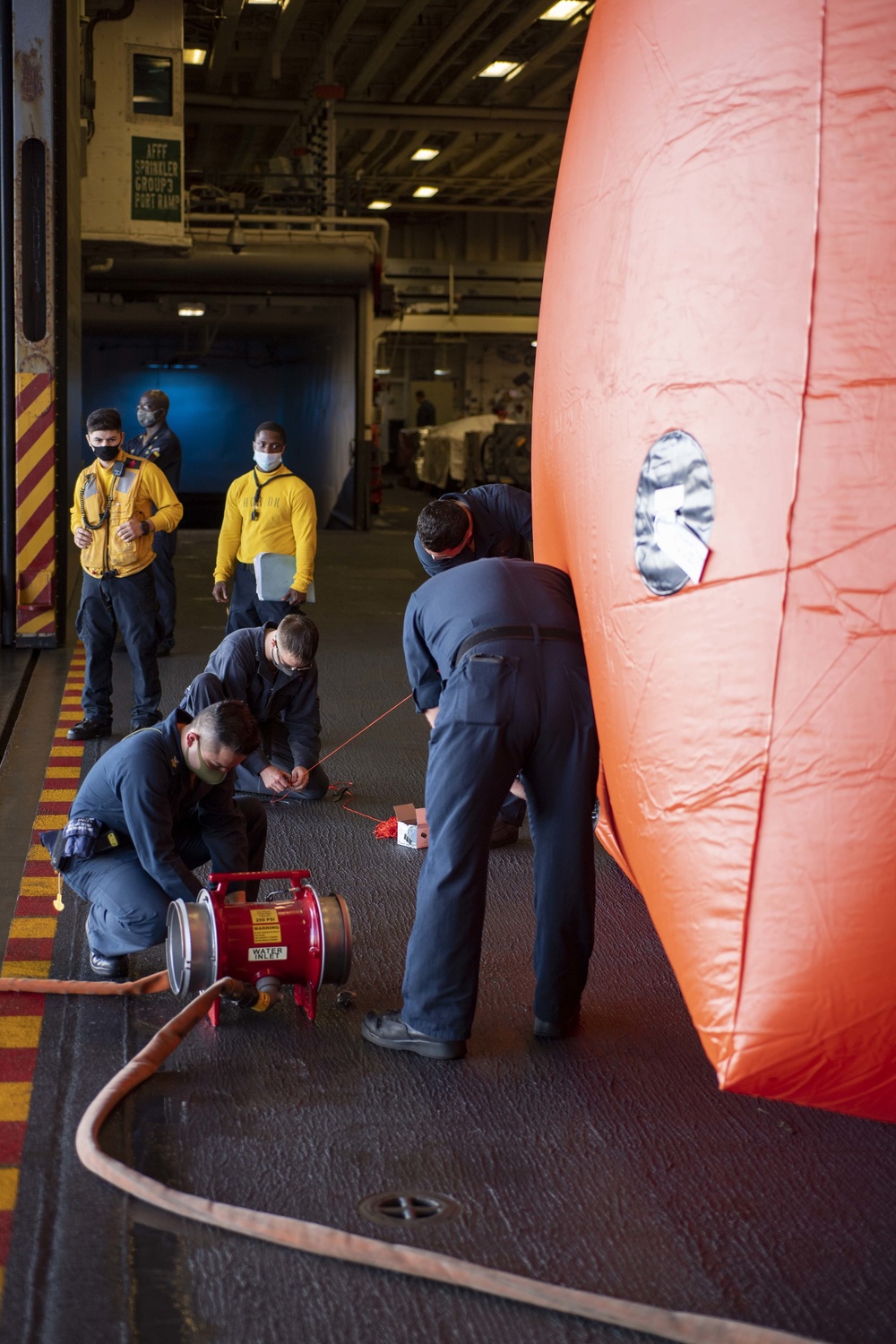 USS America (LHA 6) conducts a crew-serve weapons exercise