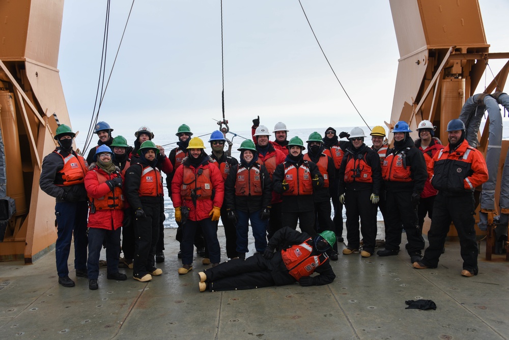 Coast Guard Cutter Healy crew members recover oceanographic research moorings