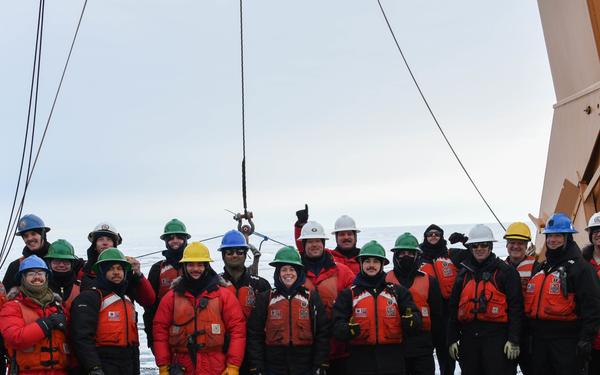 Coast Guard Cutter Healy crew members recover oceanographic research moorings