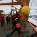 Coast Guard Cutter Healy crew members recover oceanographic research moorings