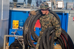 U.S. Marines and Sailors conduct at-sea live fuel transfer