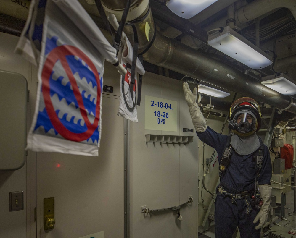 USS Billings Sailor Responds to a Simulated Flood During a Damage Control Drill