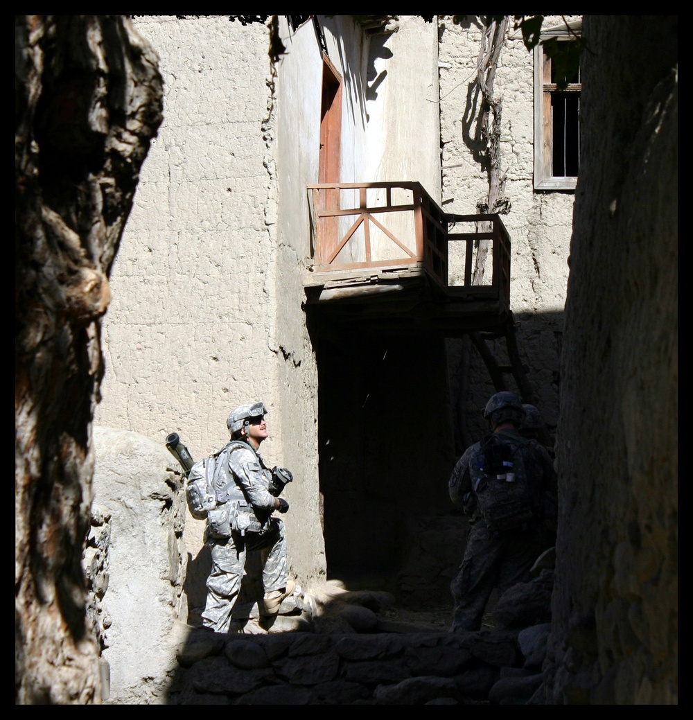 Afghan alley; scouts patrol