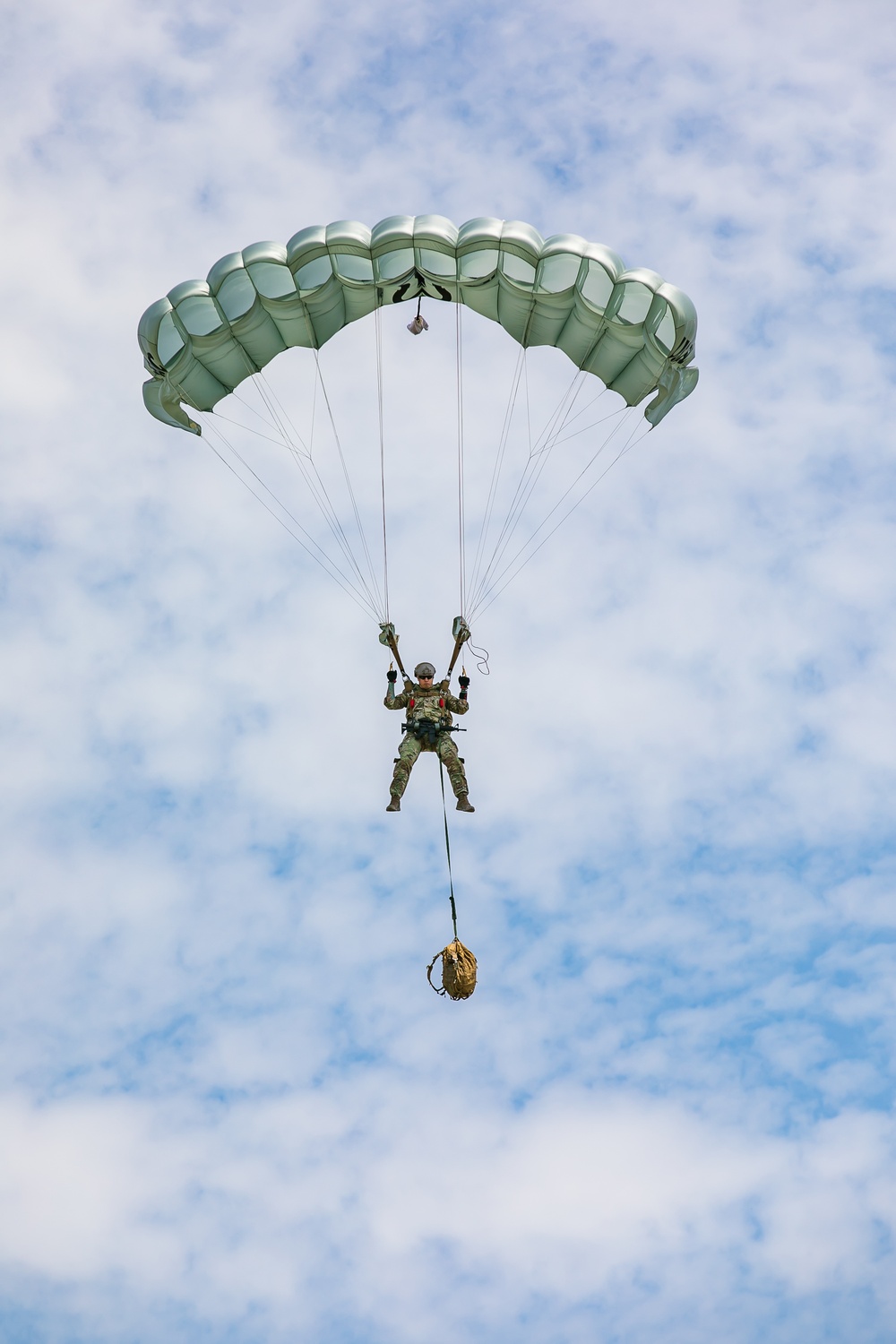 Soldier performs parachute demonstration landing for National Airborne Day