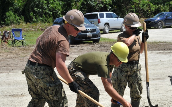 Seabees and Marines place two concrete pads on board Marine Corps Base Camp Lejeune, NC