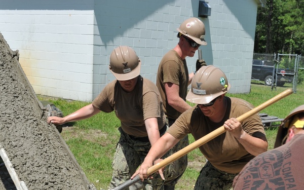 Seabees and Marines place two concrete pads on board Marine Corps Base Camp Lejeune, NC