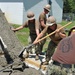 Seabees and Marines place two concrete pads on board Marine Corps Base Camp Lejeune, NC