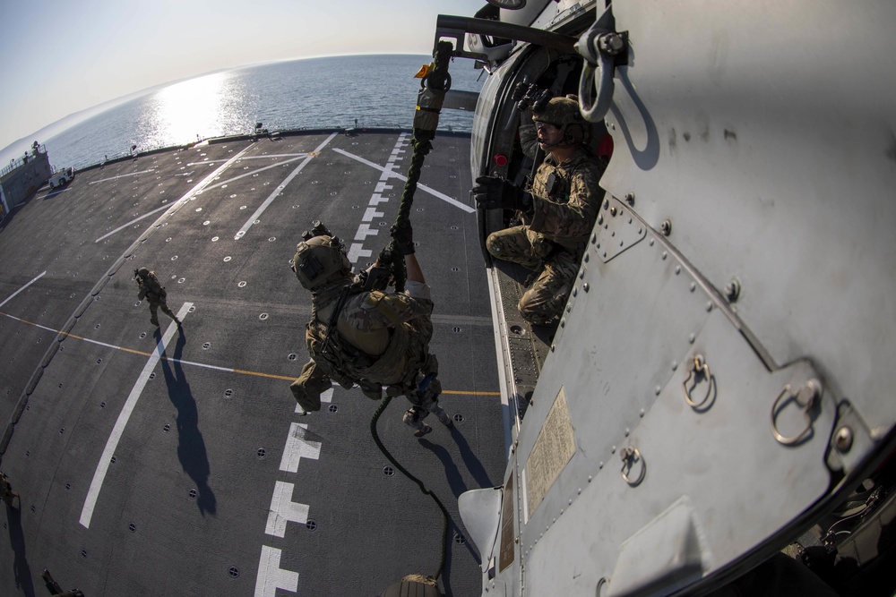 Members of MSRT fast-rope to ESB 5 from HSC 23 MH-60S Sea Hawk