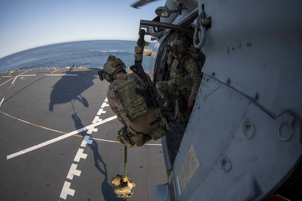 Members of MSRT fast-rope to ESB 5 from HSC 23 MH-60S Sea Hawk