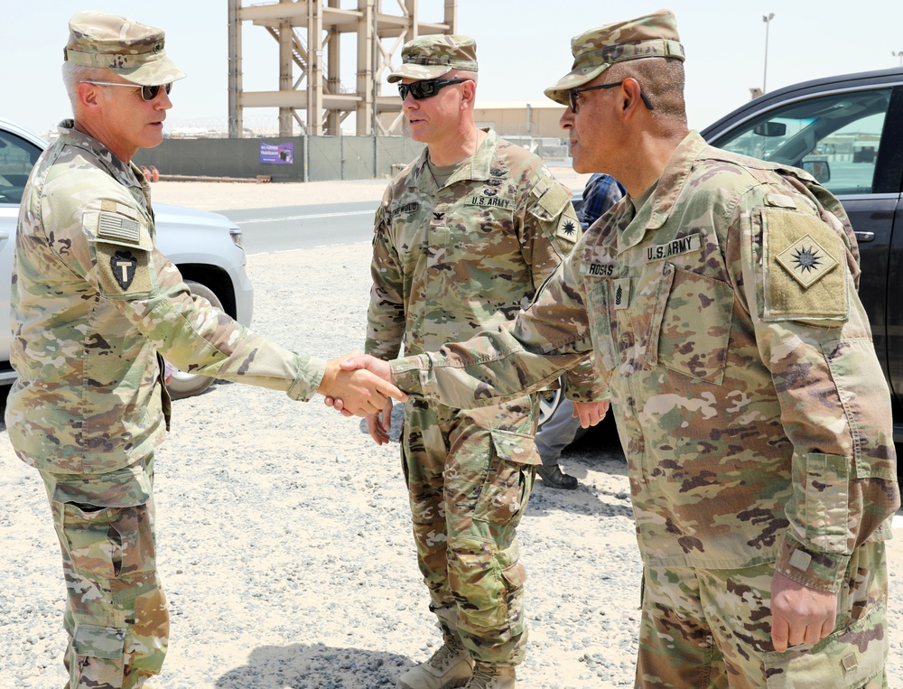 Brig. Gen. Ronald Burkett visits Camp Buehring and coins three Task Force Phoenix Soldiers