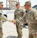 Brig. Gen. Ronald Burkett visits Camp Buehring and coins three Task Force Phoenix Soldiers