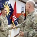 Brig. Gen. Ronald Burkett visits Camp Buehring and coins three Task Force Phoenix Soldiers