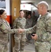 Brig. Gen. Ronald Burkett visits Camp Buehring and coins three Task Force Phoenix Soldiers