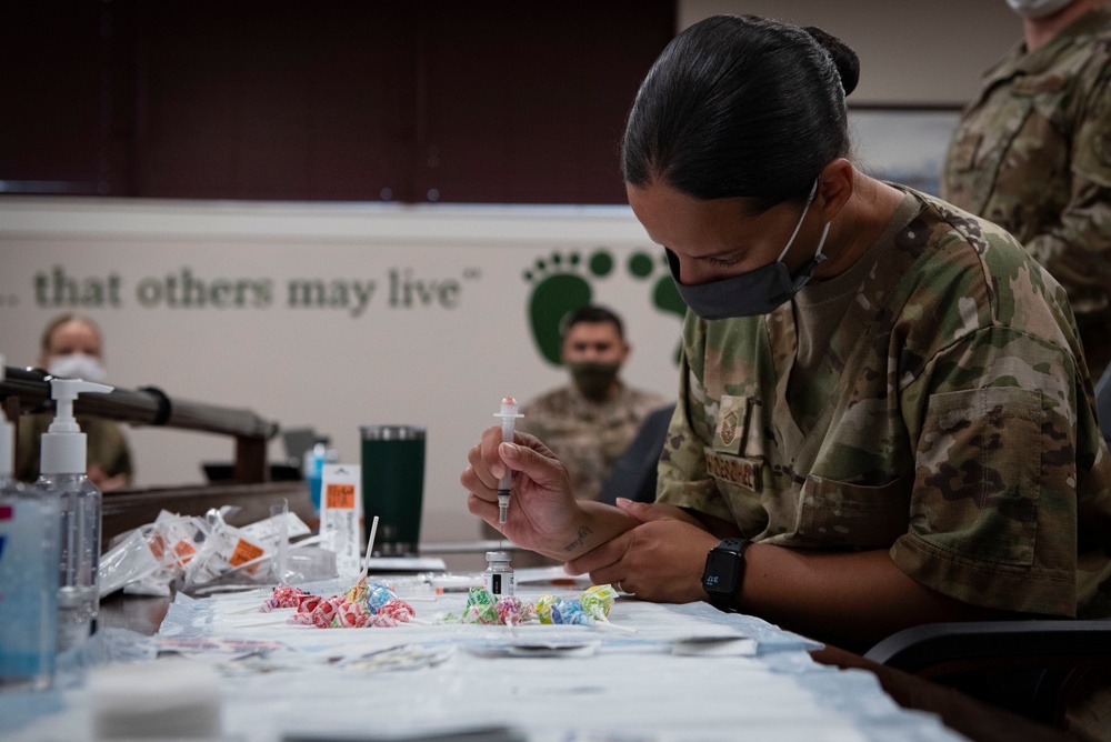 23rd MDG hosts mass vaccine line