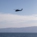 An MH-60S Sea Hawk assigned to Helicopter Sea Combat Squadron (HSC) 23 flies over the Pacific Ocean