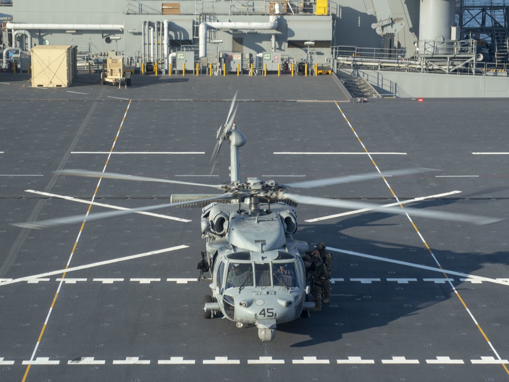 HSC 23 conducts fast rope excersises with USCG MSRT aboard USS Miguel Keith