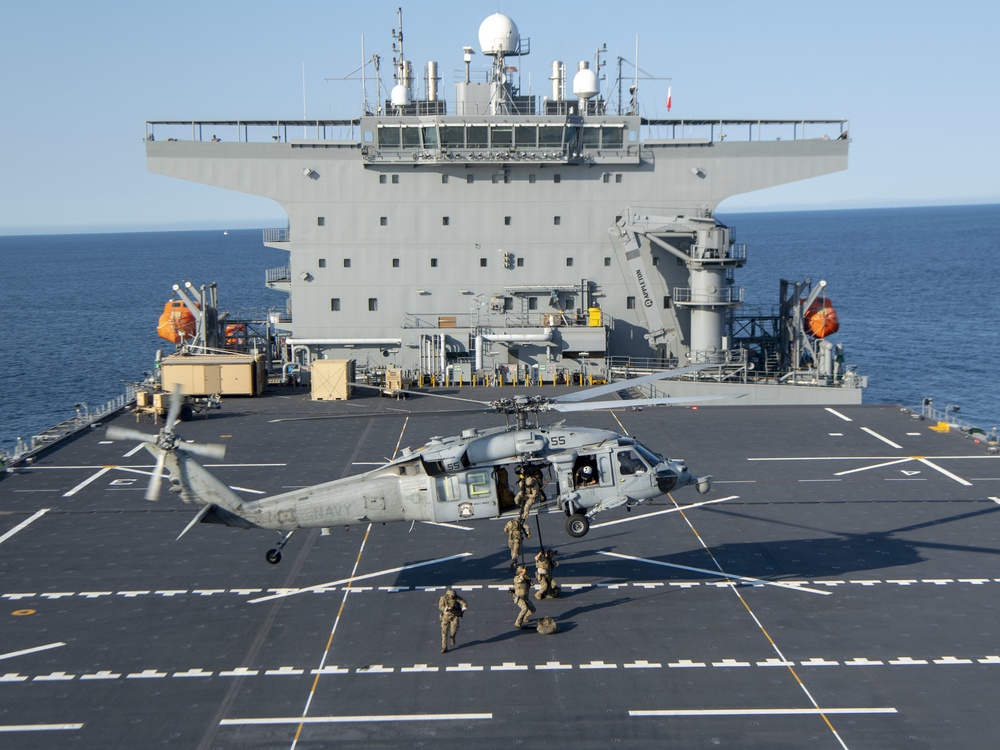 HSC 23 conducts fast rope excersises with USCG MSRT aboard USS Miguel Keith