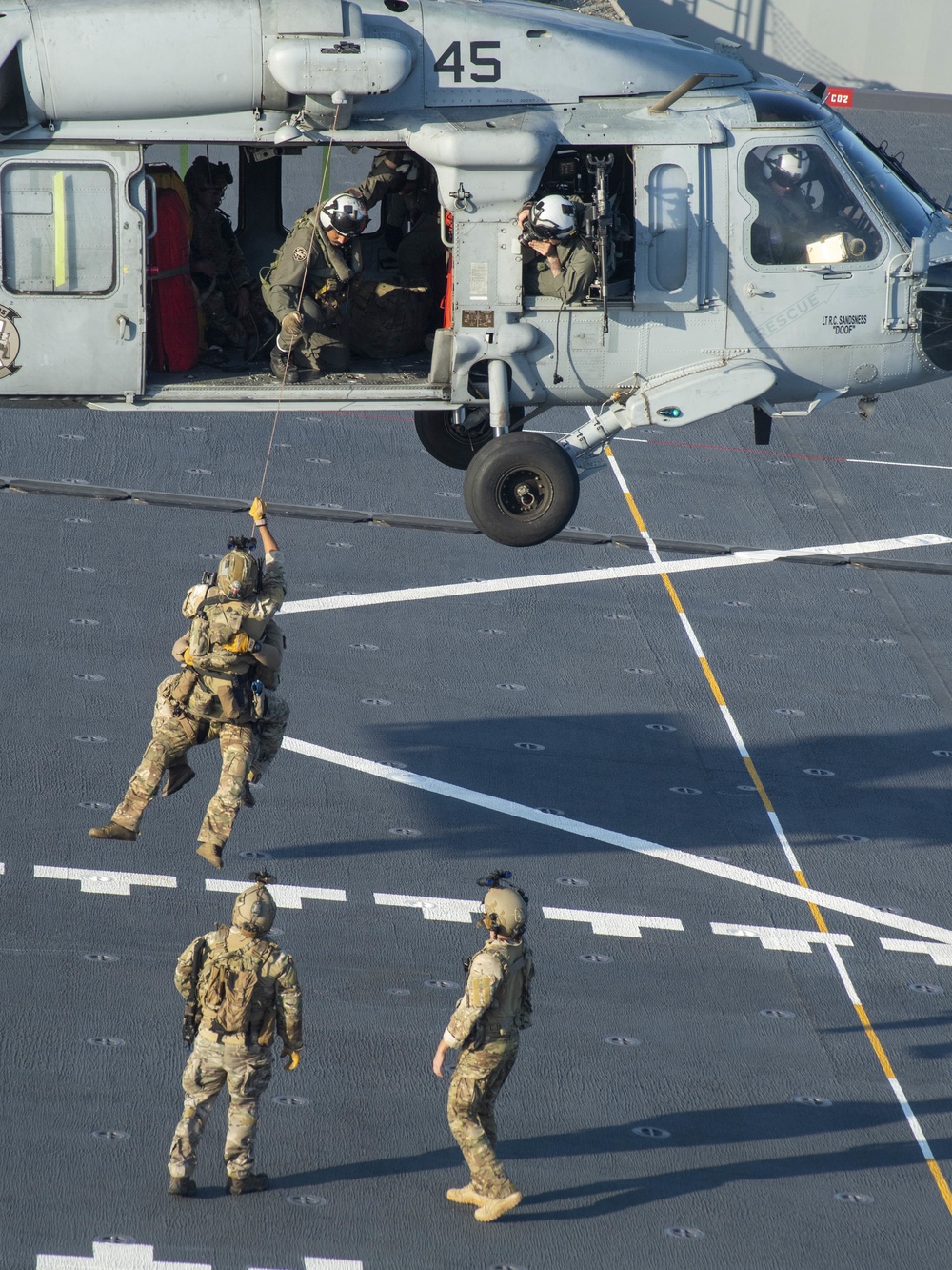 HSC 23 conducts fast rope excersises with USCG MSRT aboard USS Miguel Keith