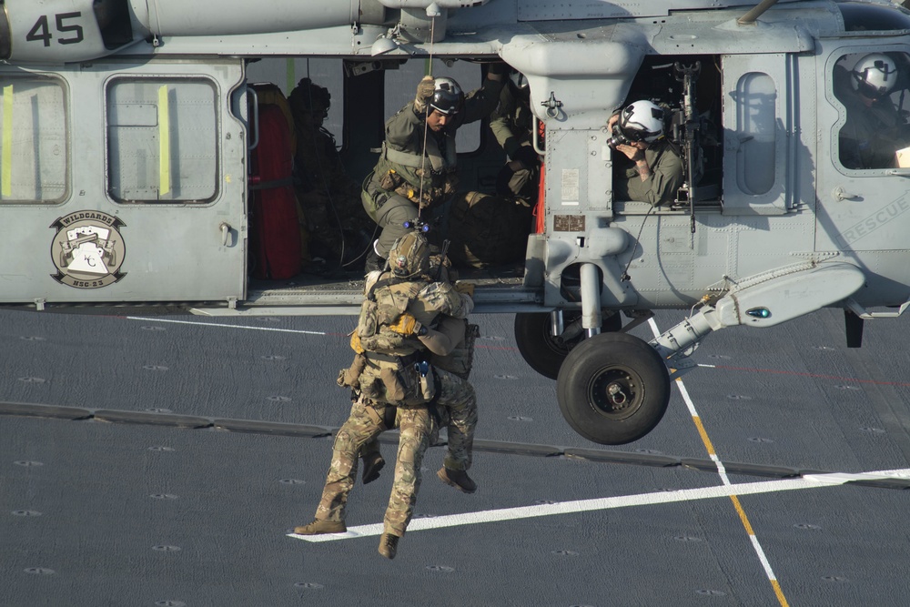 HSC 23 conducts fast rope excersises with USCG MSRT aboard USS Miguel Keith