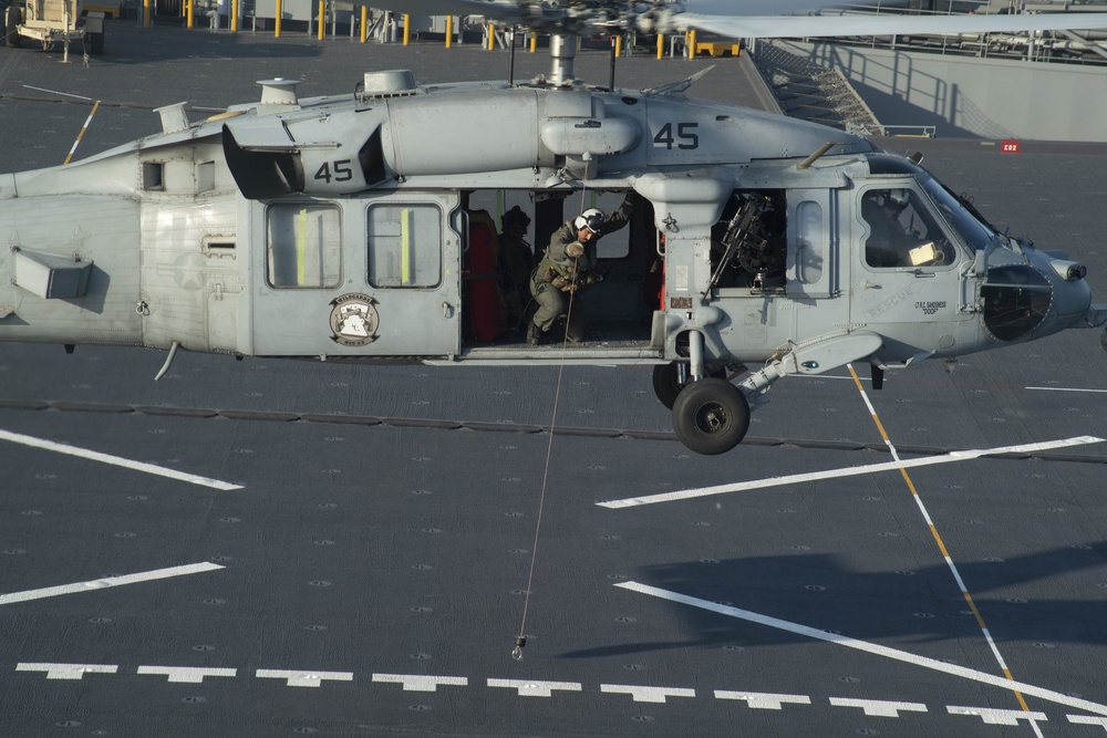 HSC 23 conducts fast rope excersises with USCG MSRT aboard USS Miguel Keith