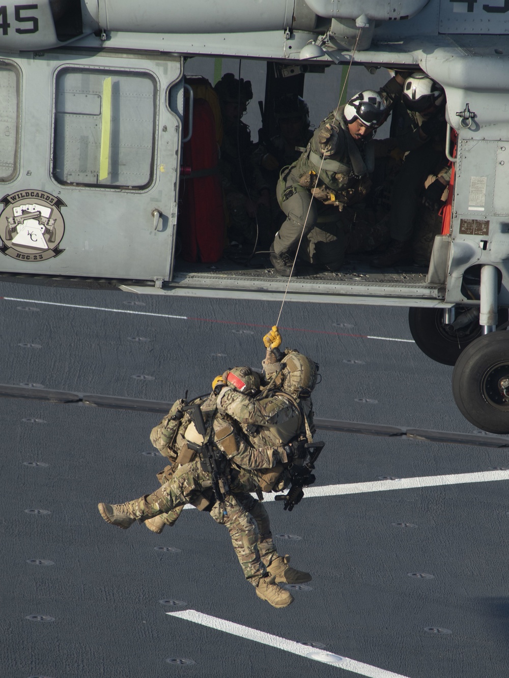 HSC 23 conducts fast rope excersises with USCG MSRT aboard USS Miguel Keith